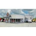 International Truck Dealership -- Kit - 8-7/8 x 12-1/4 x 3-7/8′ 22 x 31.1 x 9.3cm, HO, Walthers Cornerstone 4025