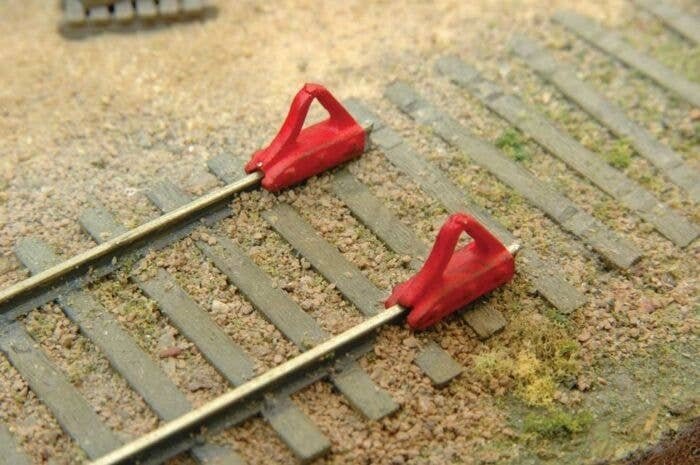 Car Stops -- Unpainted Metal Castings pkg(6), HO, Durango Press 206