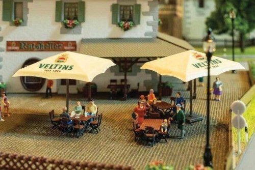 Beer Garden Set -- Veltins - 2 Umbrellas, 4 Tables, 24 Chairs, 4 Crates, 5 Barrels, HO, Faller Gmbh 180437