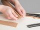 Cork Roadbed -- Each Piece: 1-3/4 x 19-11/16 x 1/8′ 4.4 x 50 x .3cm pkg(18), HO, NOCH 50412