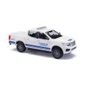 2015 Nissan Navara/Frontier Crew-Cab Pickup Truck - Assembled -- THW (white, blue, German Let, HO, Busch Gmbh & Co Kg 53723